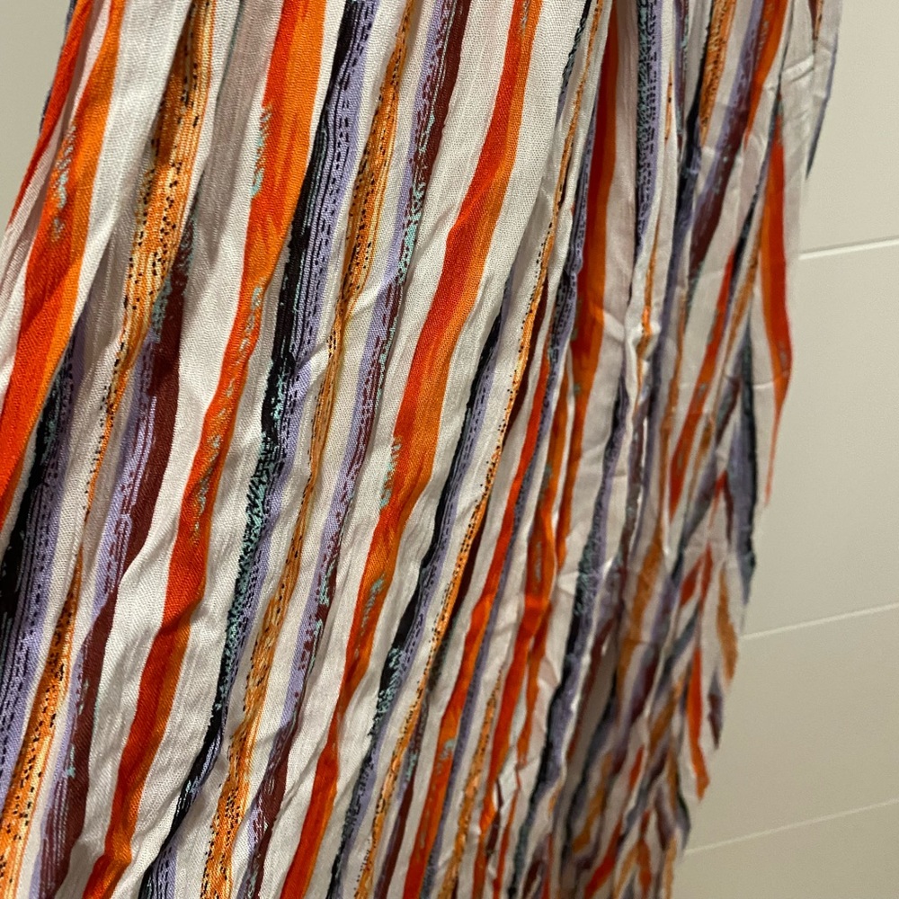 Colorful striped maxi dress with cross back detail. New with tags.